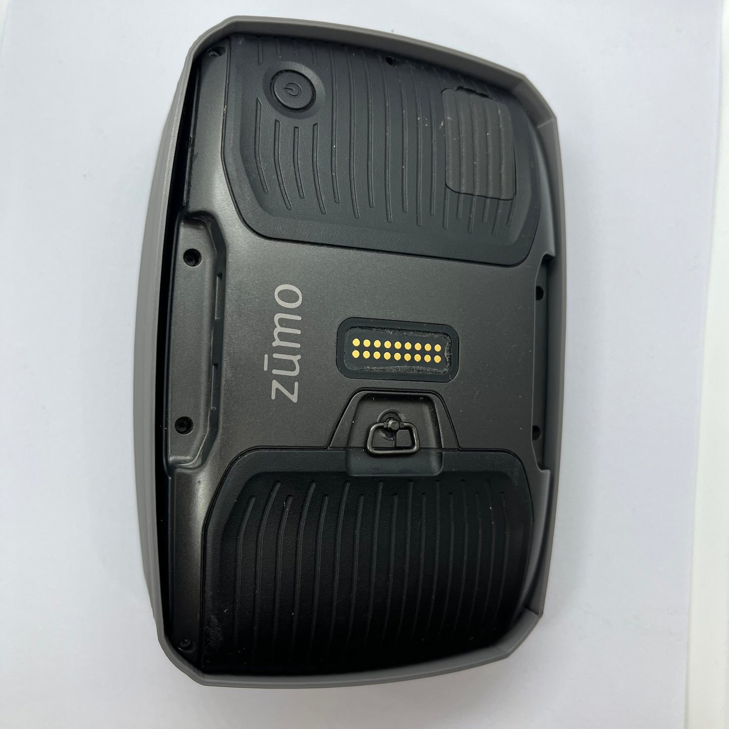 Black device with 'zumo' branding on a white background