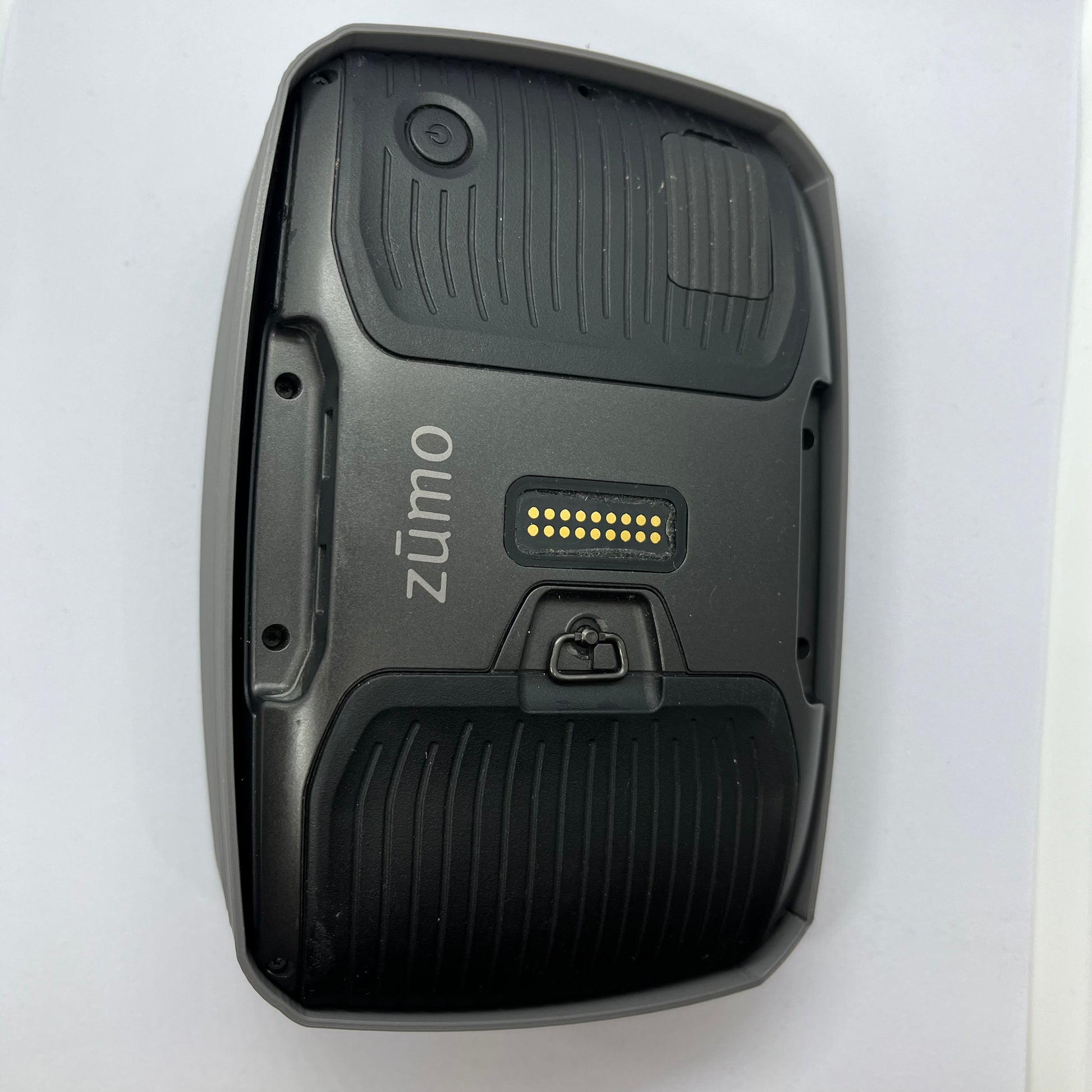 Black device with 'zumo' branding on a white background